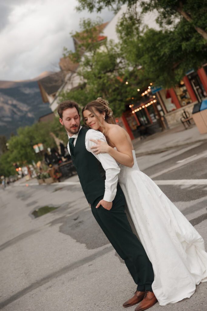 Couple embracing during golden hour in downtown canmore