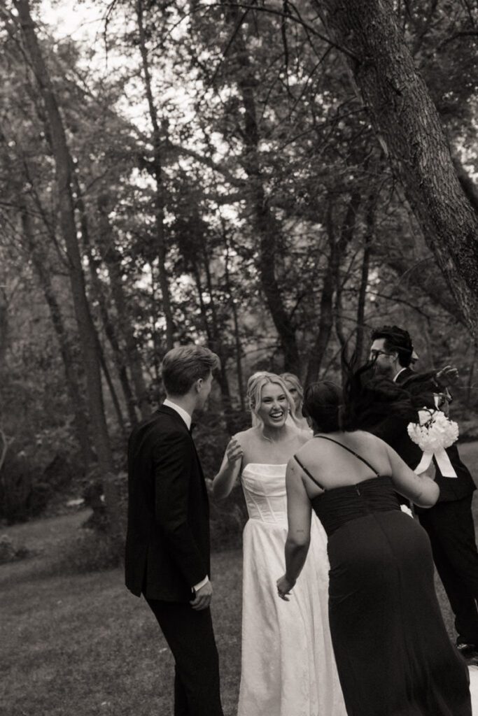Bride and groom hugging family and friends after the ceremony in moon lake wedding photography