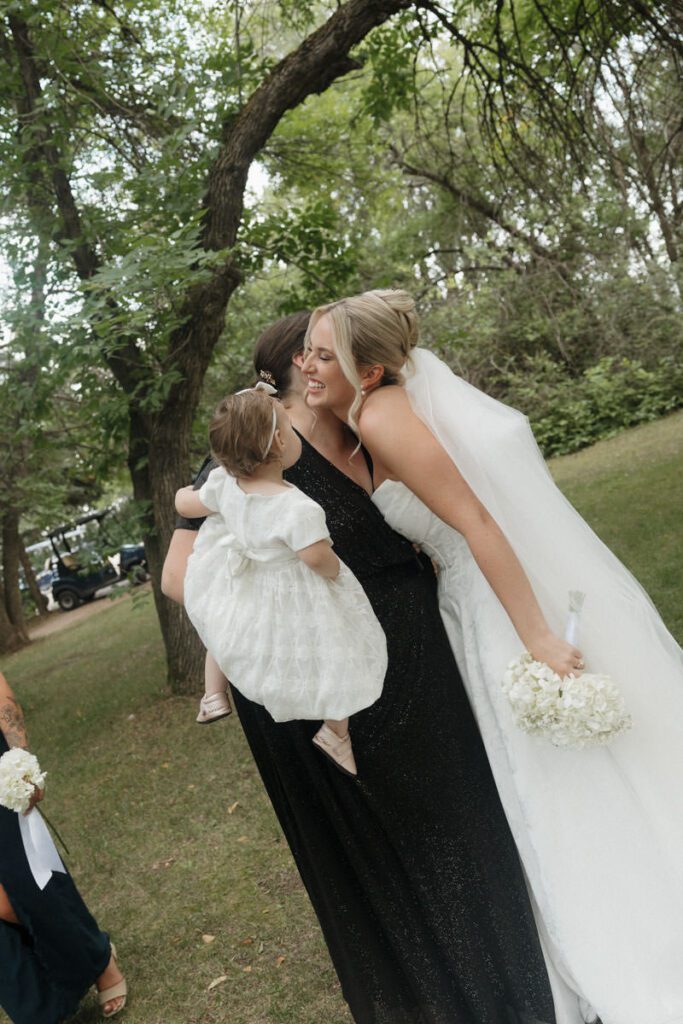Bride and groom hugging family and friends after the ceremony in moon lake wedding photography