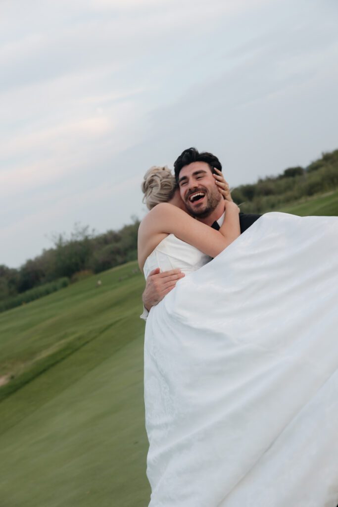 couple laughing during their golden hour portraits in moon lake wedding photography