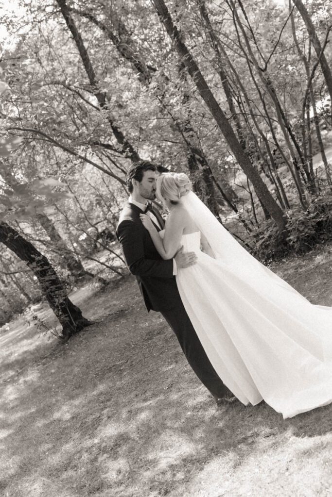 bride and groom kissing in moon lake wedding photography