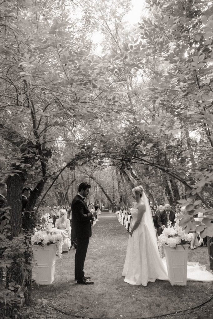 Couple exchanging vows during their moon lake wedding photography