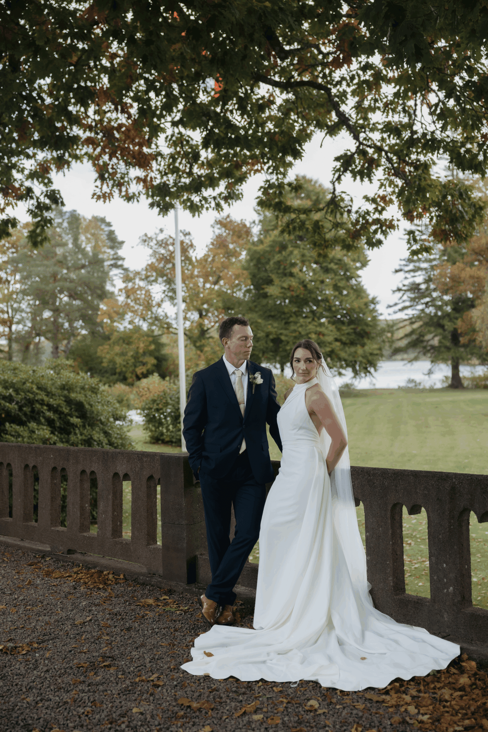 Candid laughter shared between newlyweds during portraits.