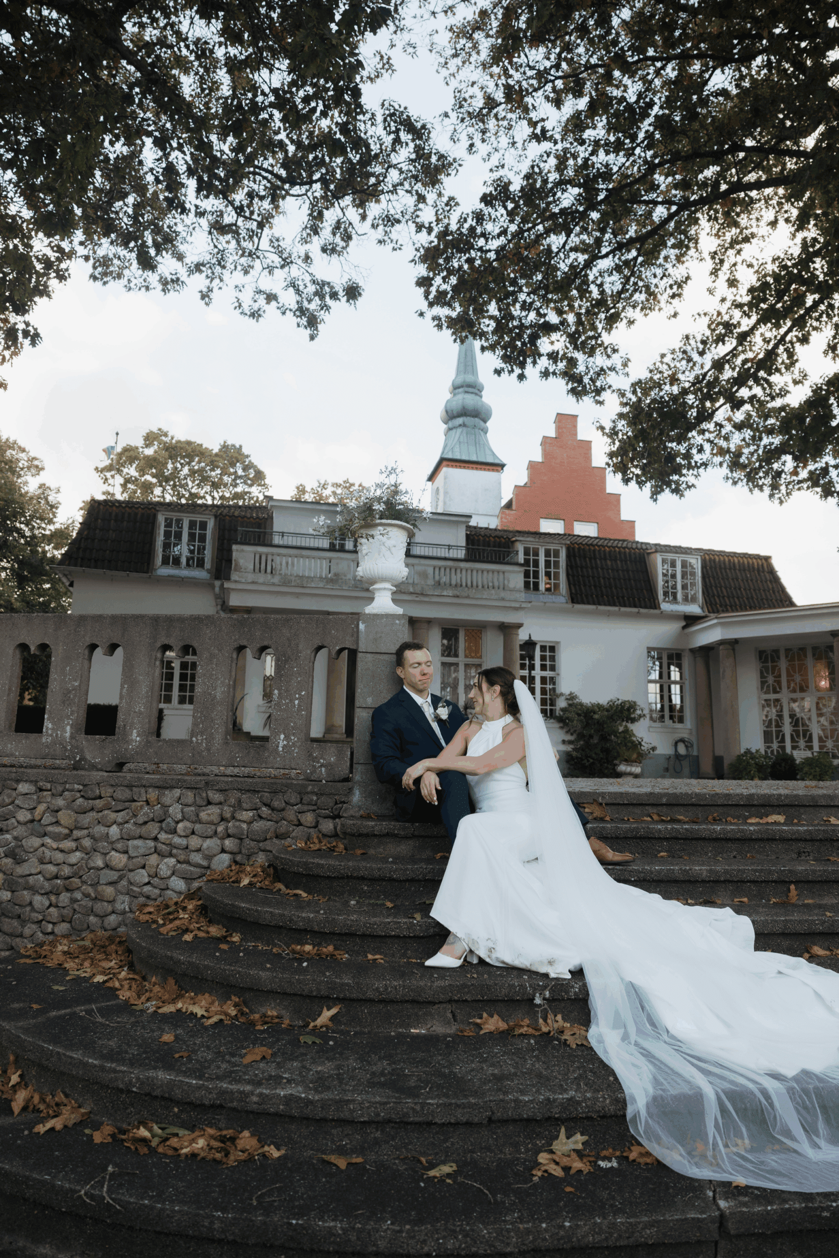 Couple embracing outdoors after their ceremony.
