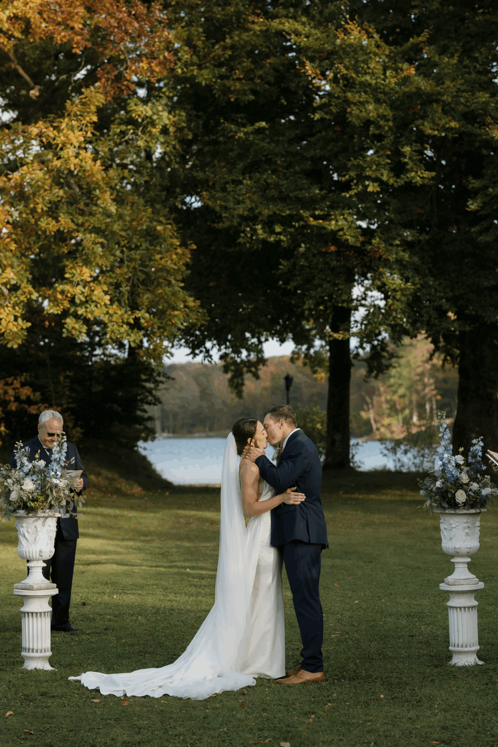 Outdoor wedding ceremony surrounded by family and friends.