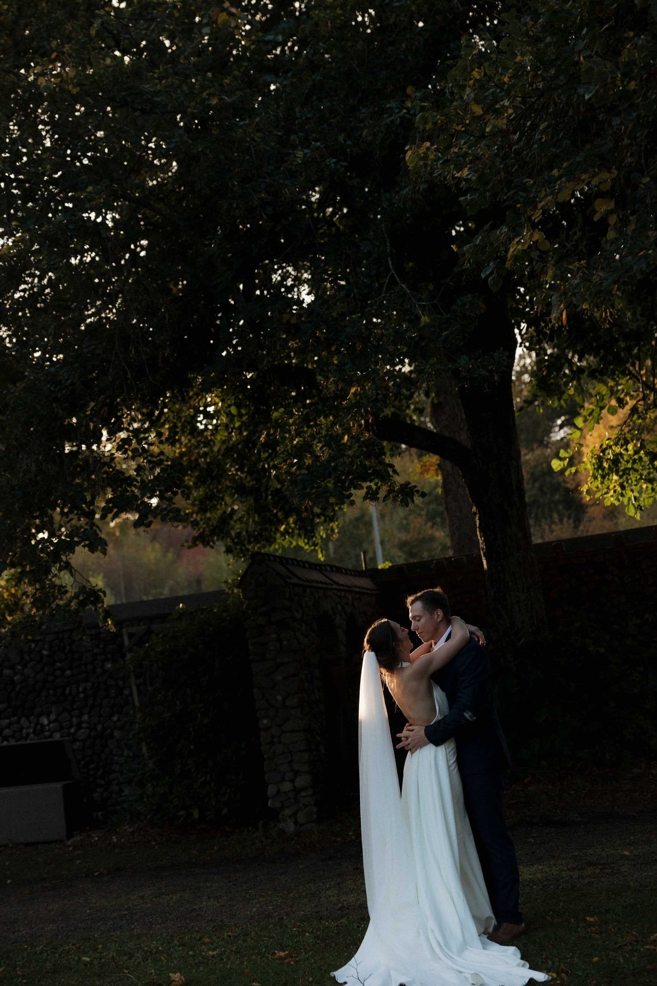Romantic wedding portraits captured in golden evening light.
