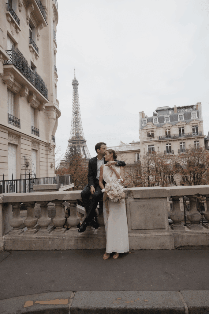 Bride and groom during an intimate Paris elopement with the Eiffel Tower in the distance.