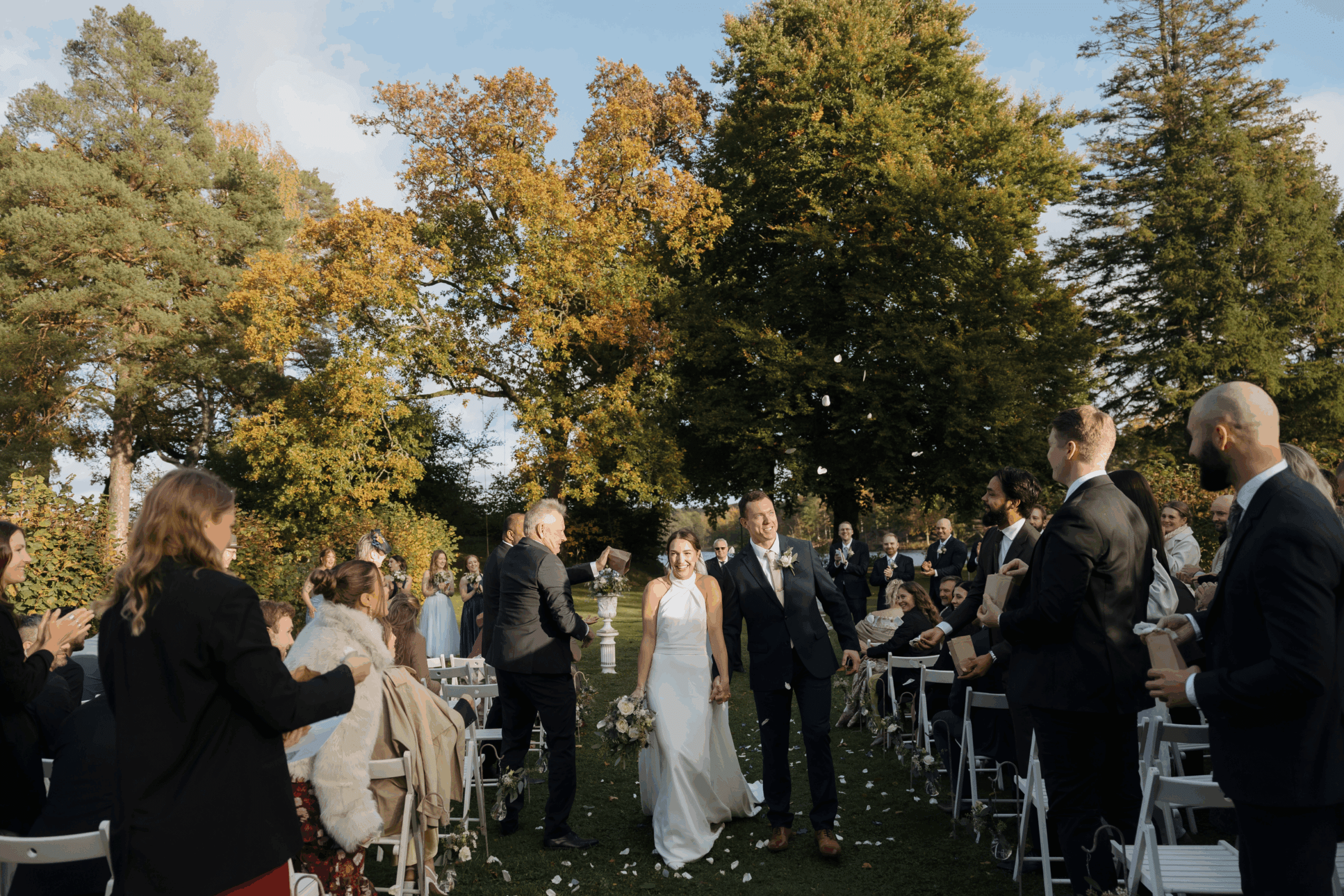 Guests smiling and celebrating during the ceremony.