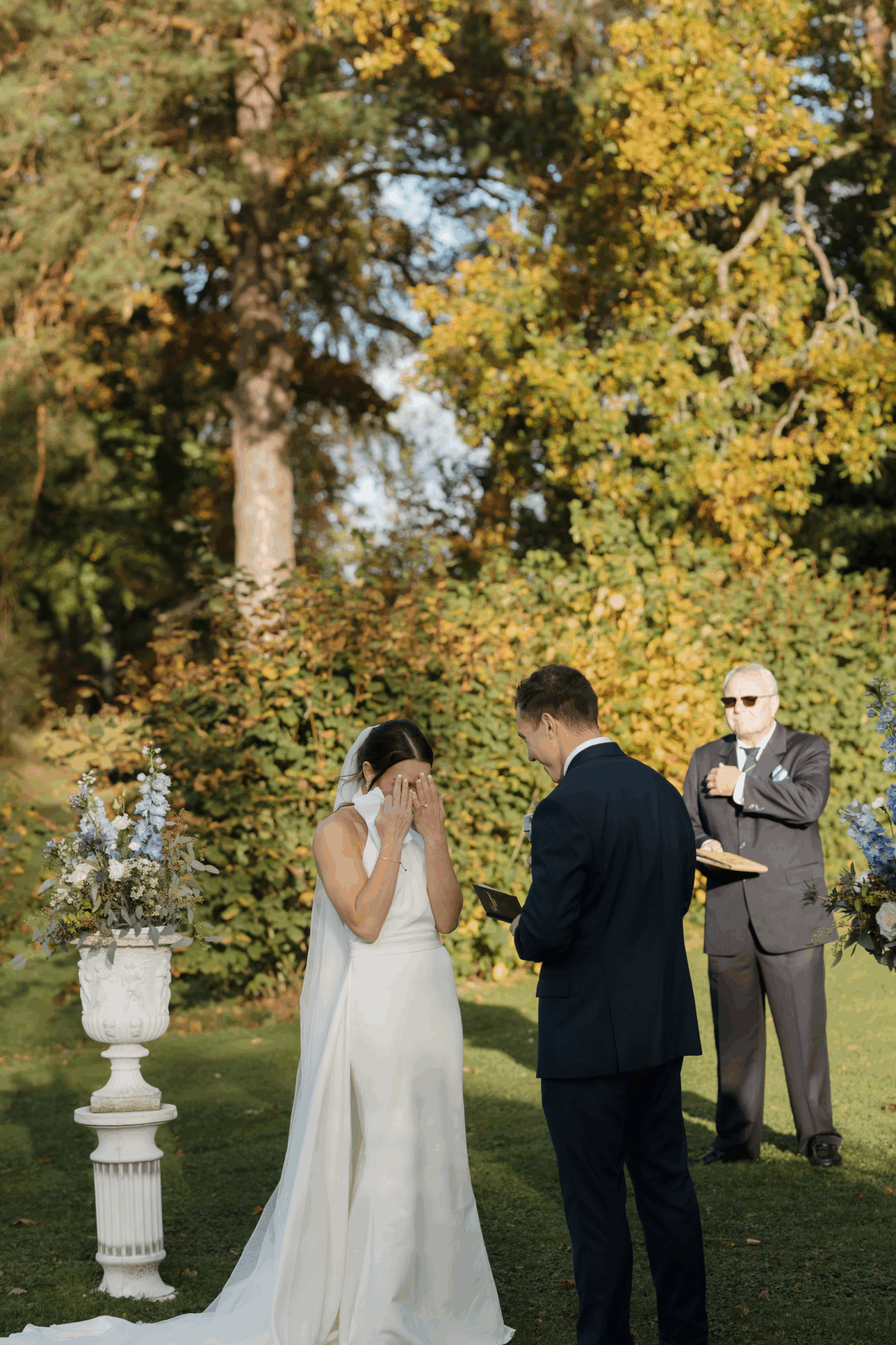Bride and groom exchanging vows during an intimate ceremony.