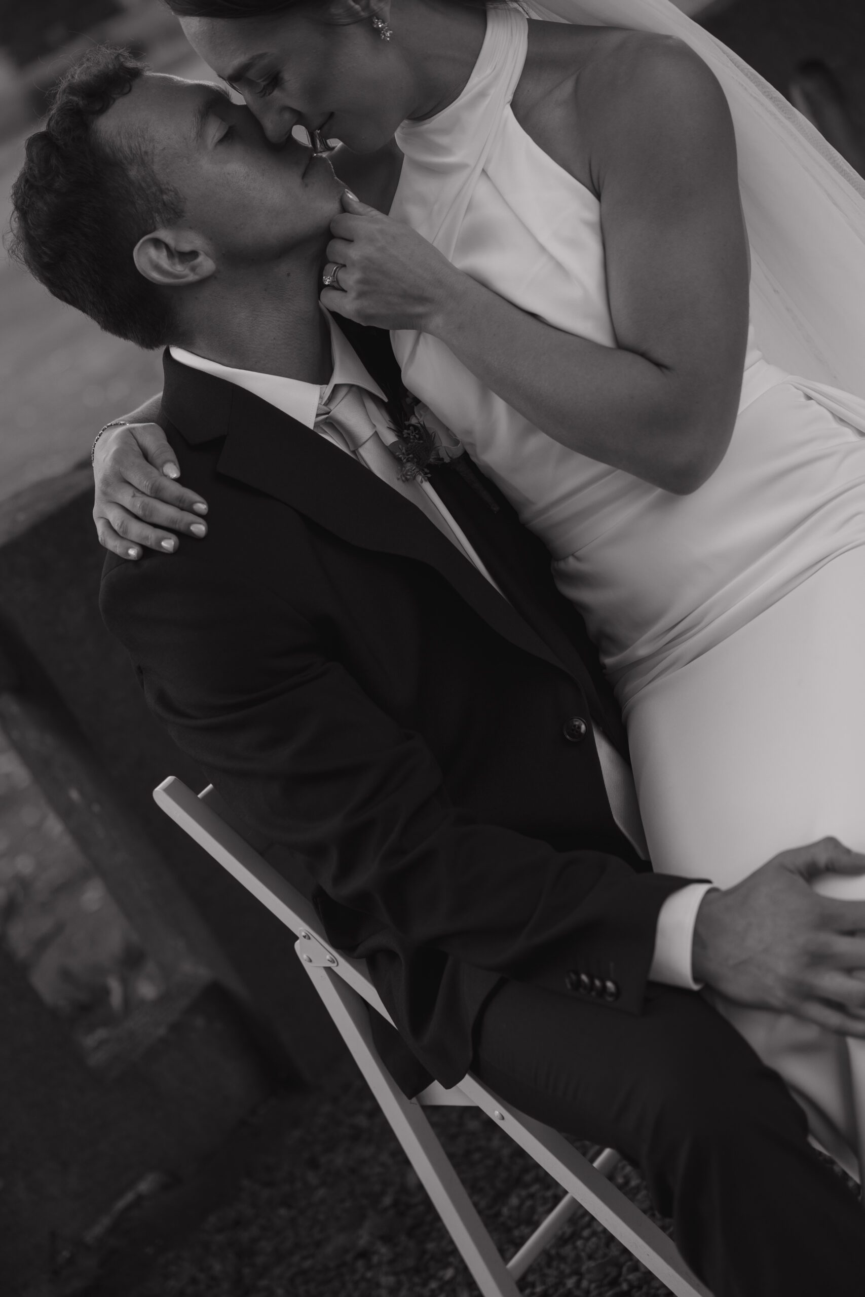 Candid laughter shared between newlyweds during portraits.