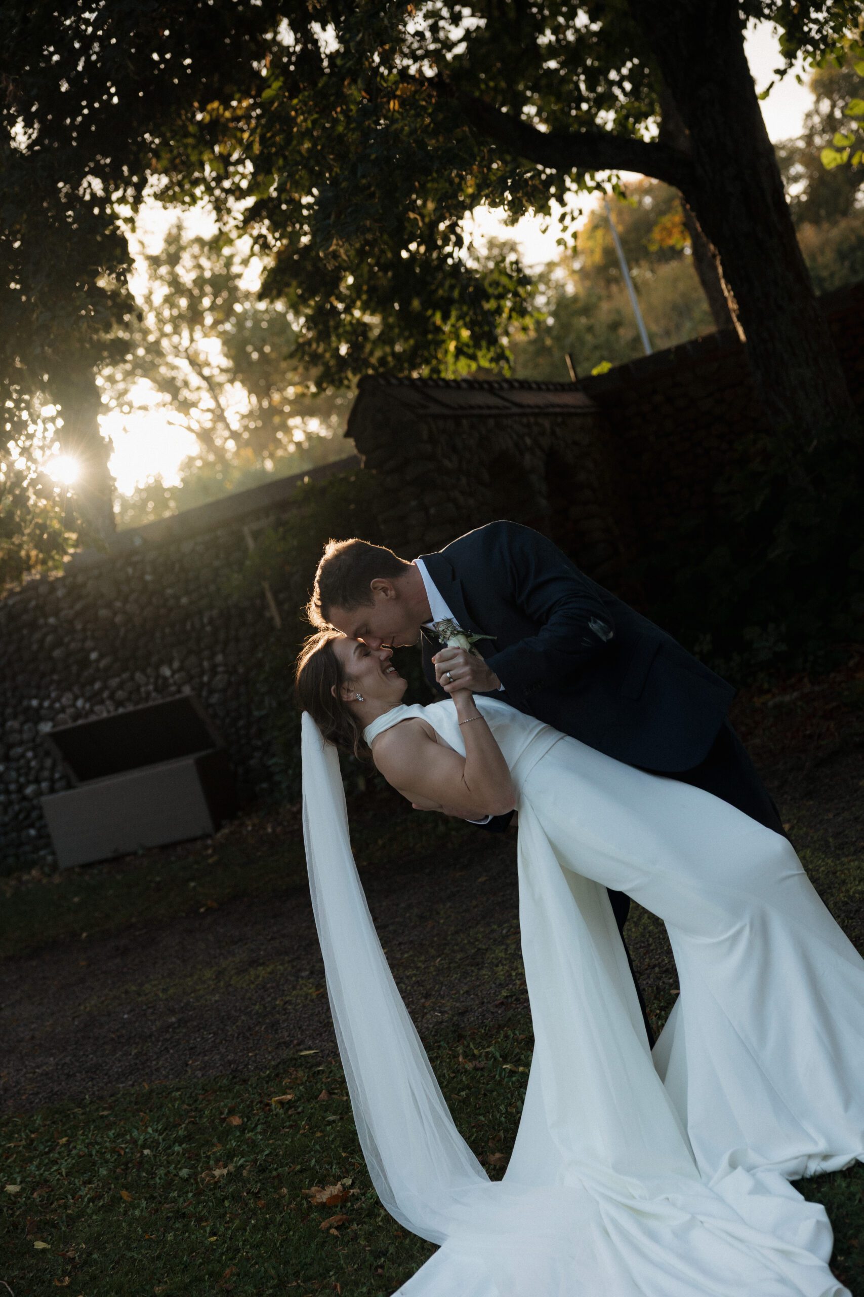 Candid laughter shared between newlyweds during portraits.